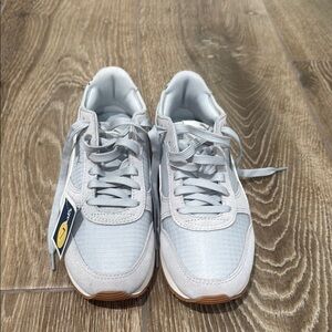 Brand new (with tags) stylish soft foam Puma light blue and gray sneakers